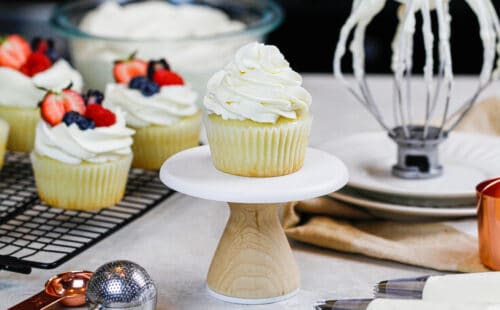 image of cupcake frosted with whipped cream frosting with cream cheese