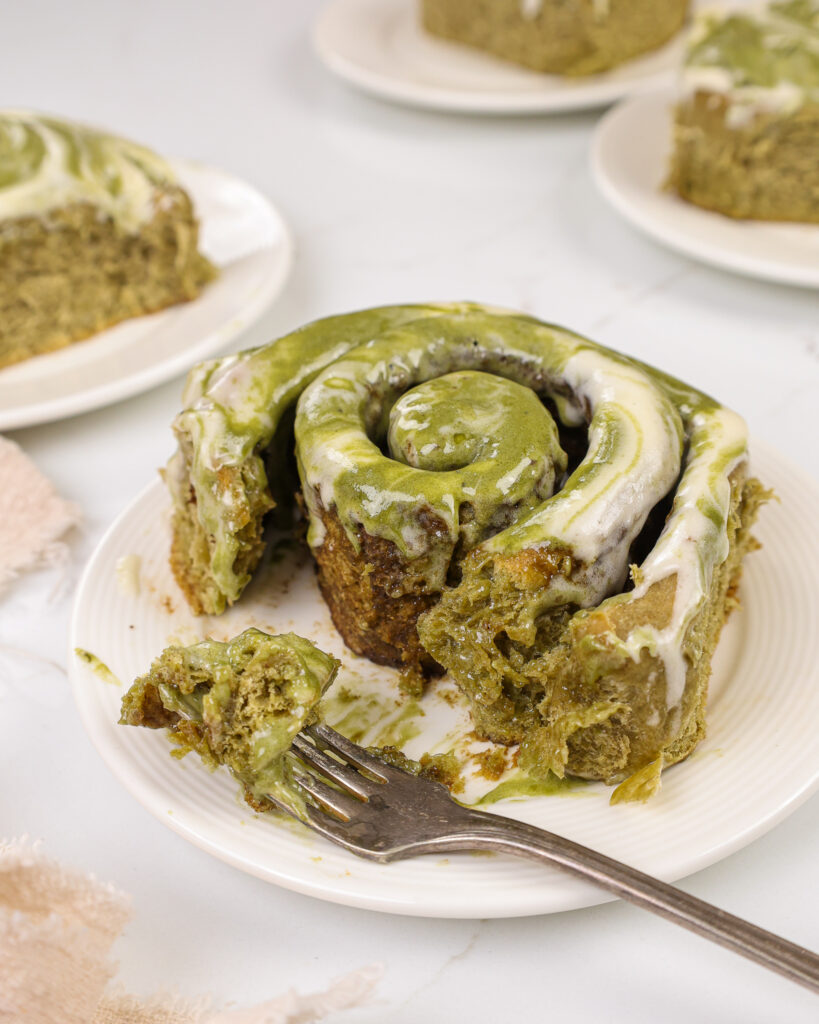 image of matcha cinnamon rolls that have been cut into to show how fluffy and soft they are