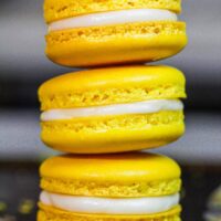 image of french lemon macarons filled with lemon curd and fresh lemon buttercream frosting