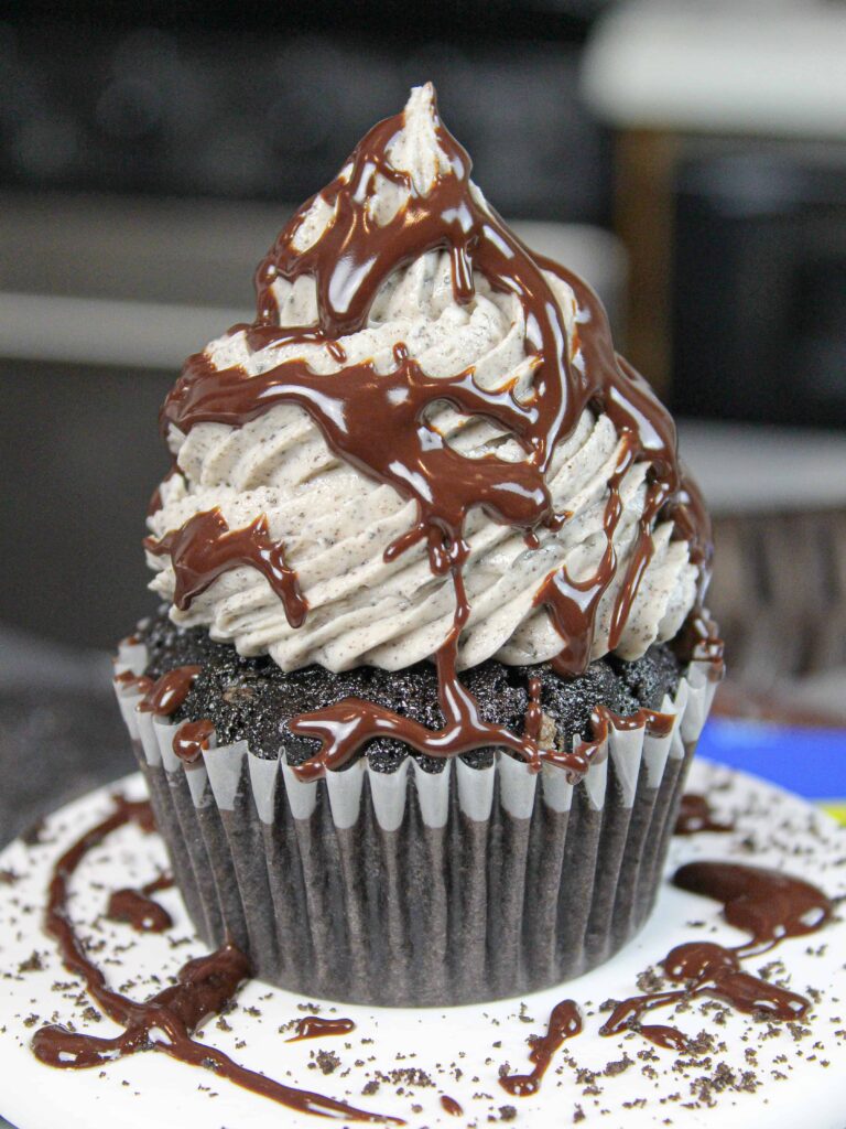 image of oreo cupcake drizzled with chocolate ganache