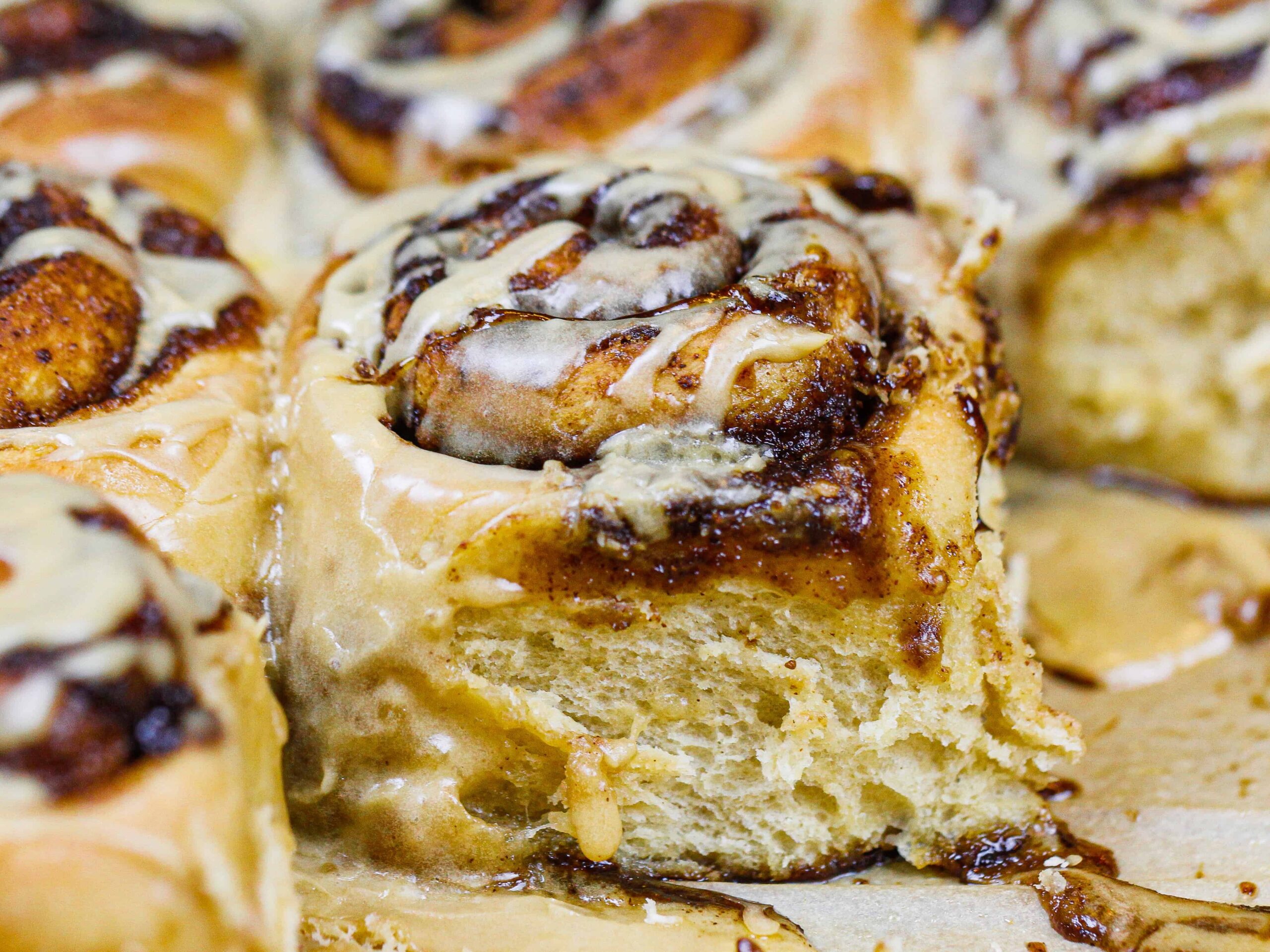 image of coffee cinnamon rolls covered in an espresso glaze